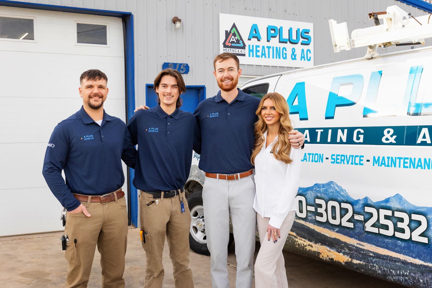 aplus-heatingandair team in front of company headquarters and service van